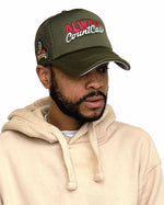 Load image into Gallery viewer, “Griselda Blanco” ACC Trucker Hat Olive/Olive
